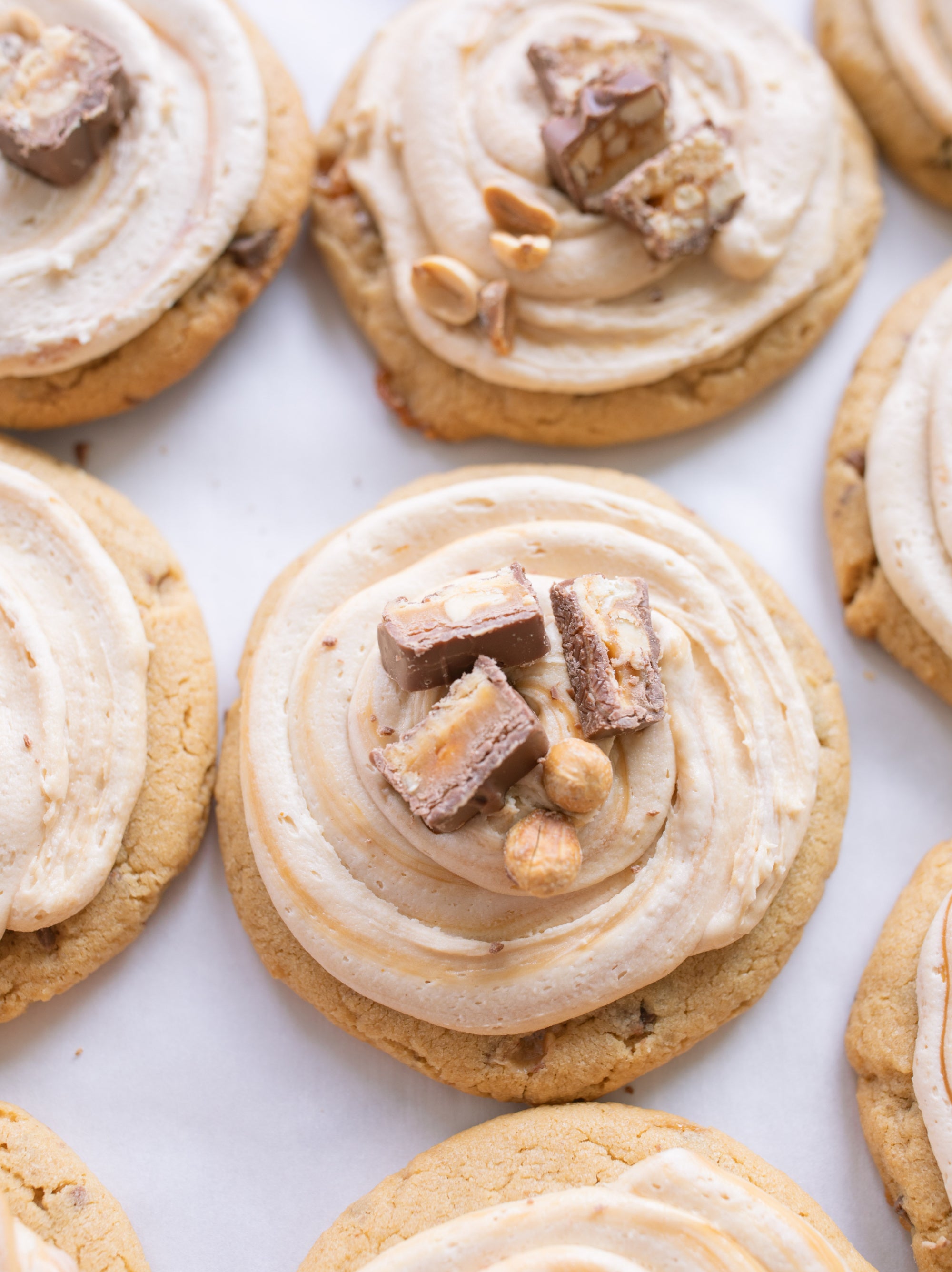 Frosted Peanut Butter Carmel Snickers Cookies