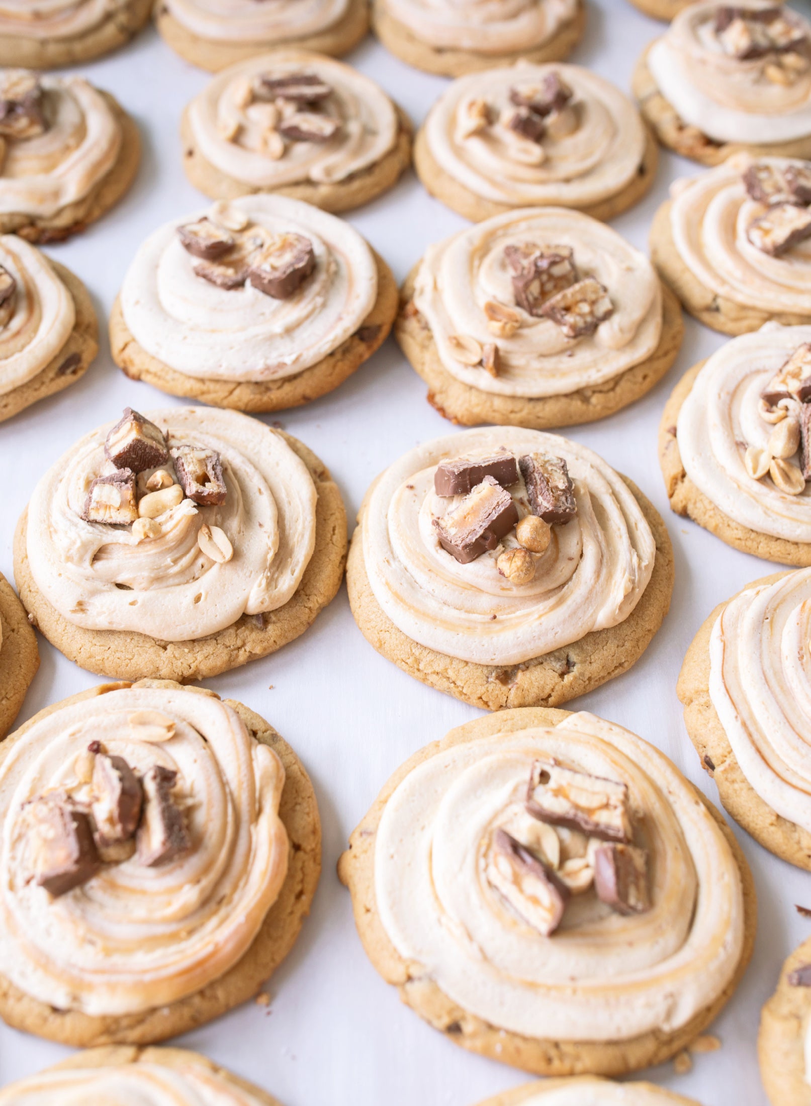 Frosted Peanut Butter Carmel Snickers Cookies